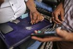 Traders inspect diamonds at a diamond market in Surat in Gujarat, India.