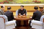 North Korean leader Kim Jong-Un attends a meeting with a committee of the Workers' Party of Korea about the test of a hydrogen bomb, at an unknown location.