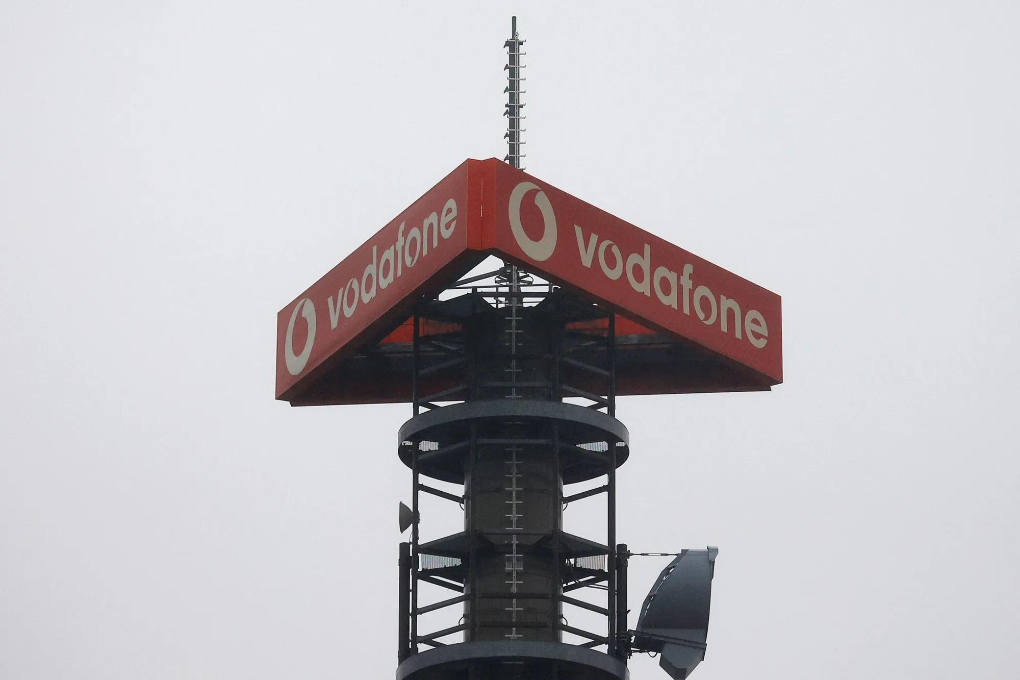 Signage for Vodafone Group Plc on top of a telecommunications relay mast in Berlin.