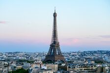Eiffel Tower silhouette against pastel evening sky