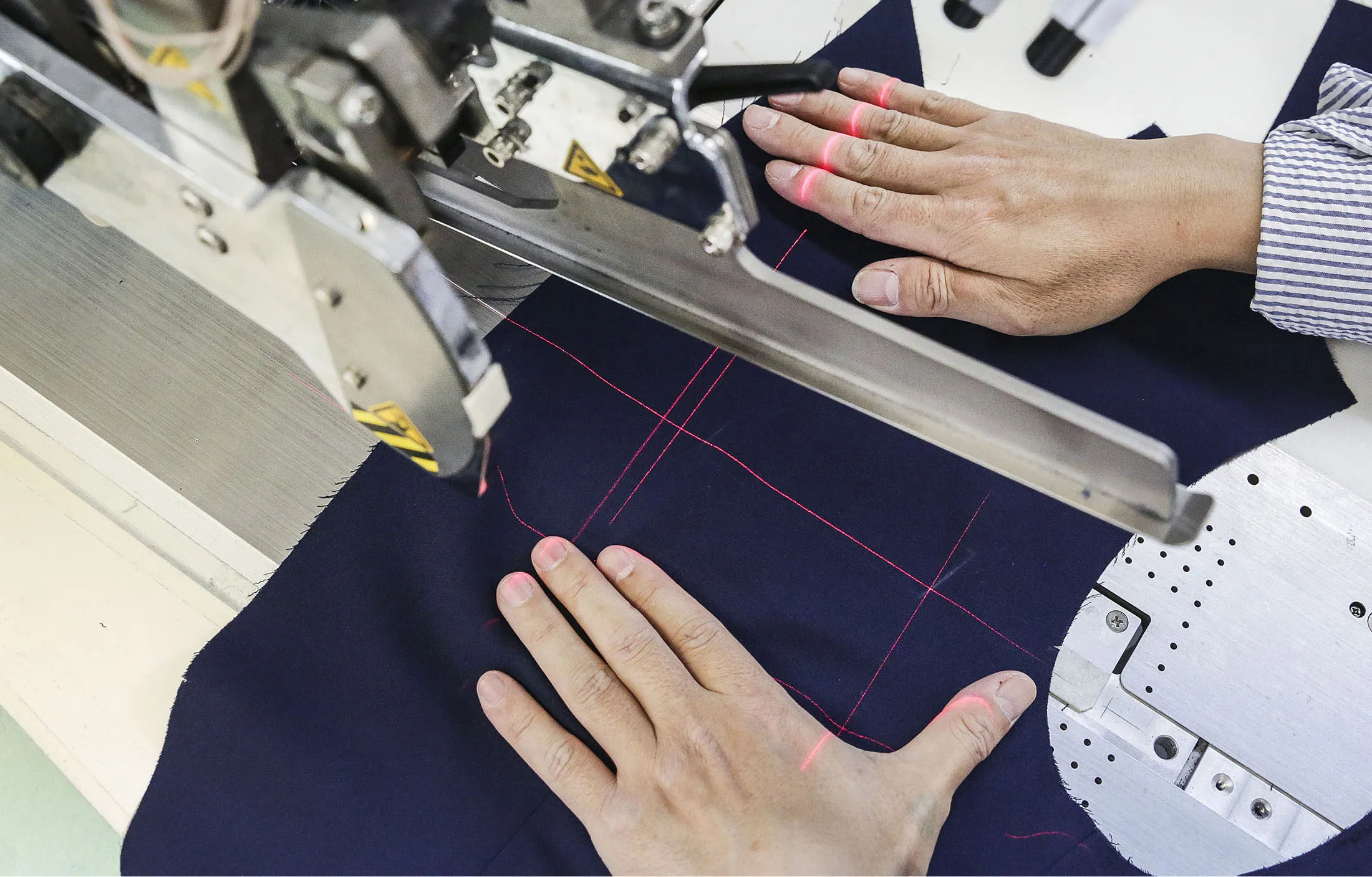 A worker measures a pocket for&nbsp;a blazer at a&nbsp;clothing factory in the Garment District of New York.