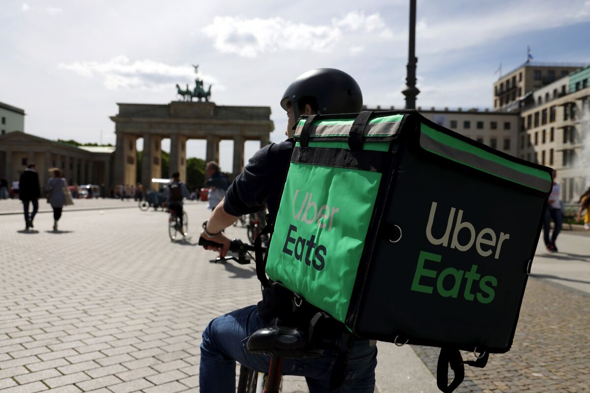 bloomberg.com - Edwin Chan - Uber Agrees to Buy Delivery Hero as Food Sector Consolidates