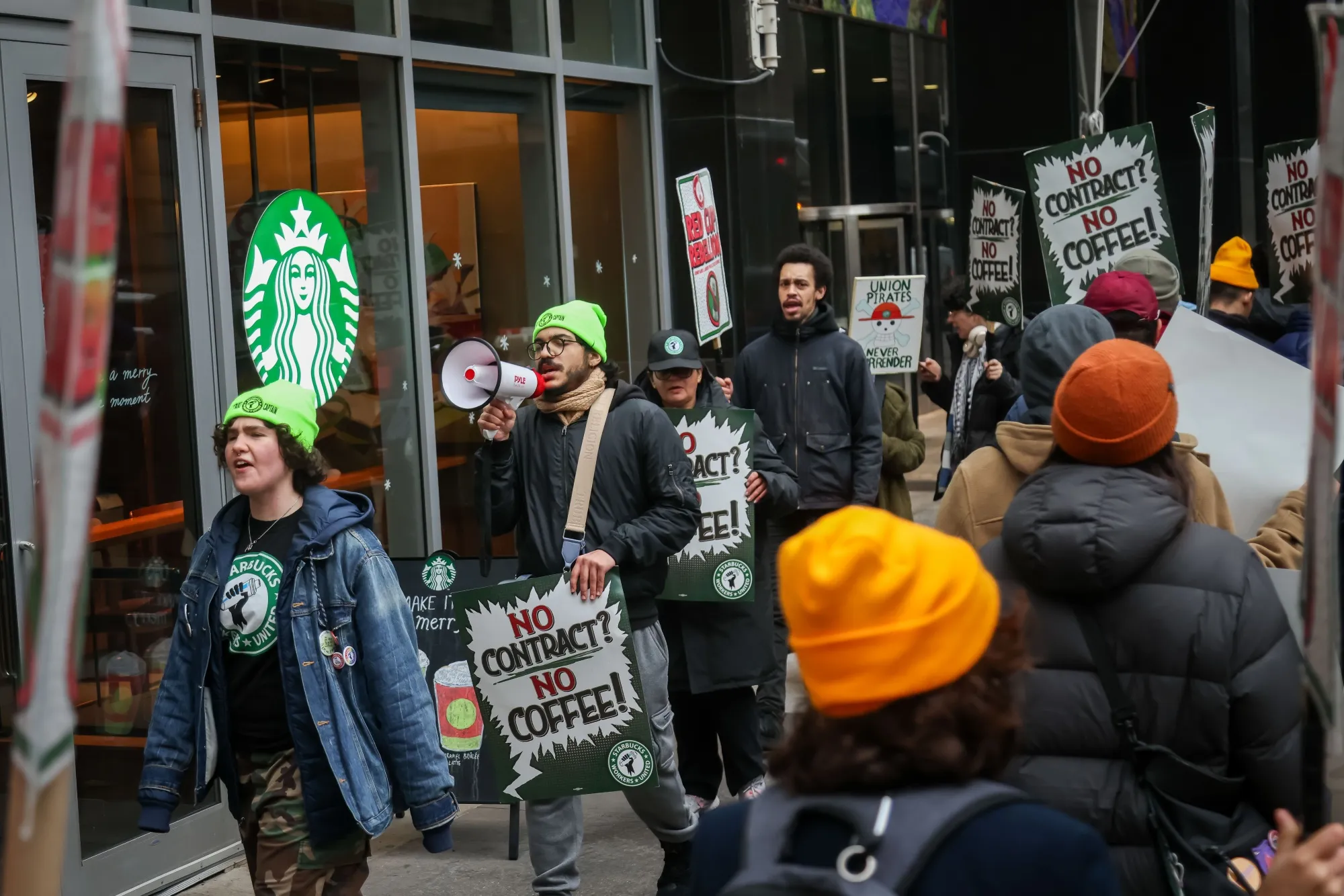 Starbucks Workers United members and supporters picket outside a Starbucks store in New York in November.