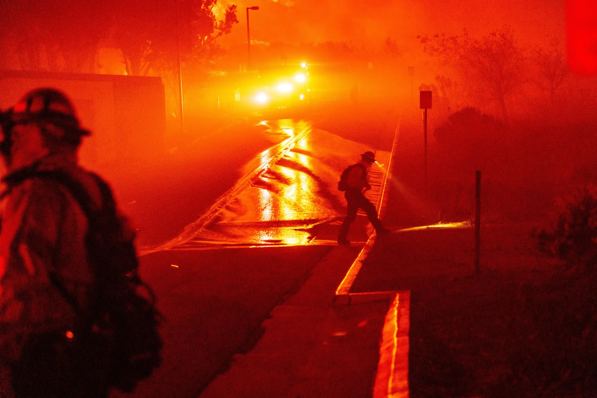Firefighters monitor the Franklin&nbsp;Fire, which is burning largely uncontained through Malibu, California.