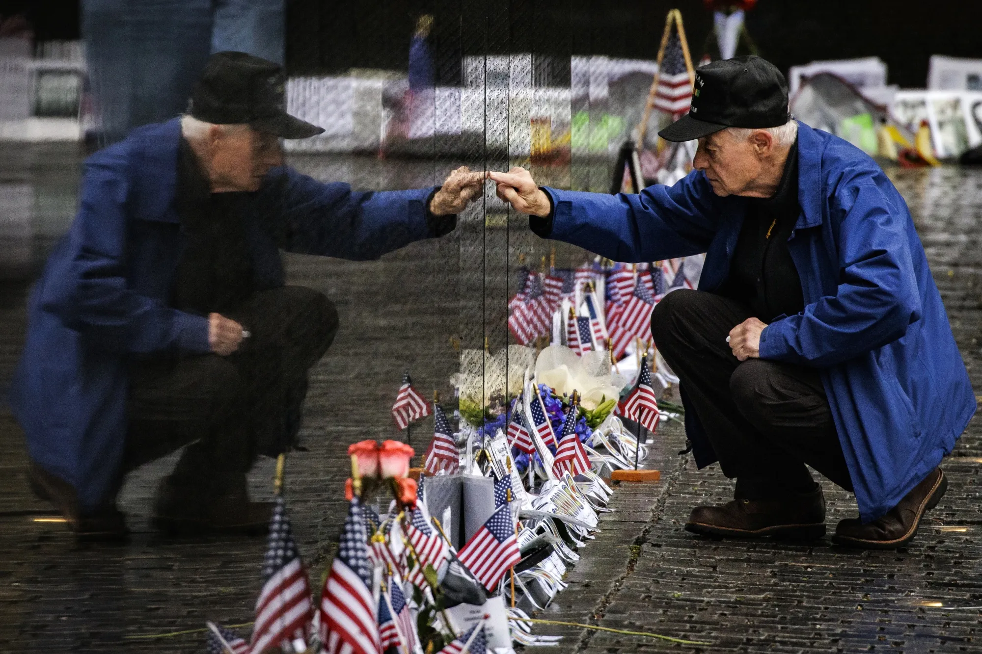 David Loesch, a 101st Airborne Veteran of the Vietnam War, searches for the names of soldiers from his unit on&nbsp;the Vietnam Veterans Memorial&nbsp;during Memorial Day last year.&nbsp;