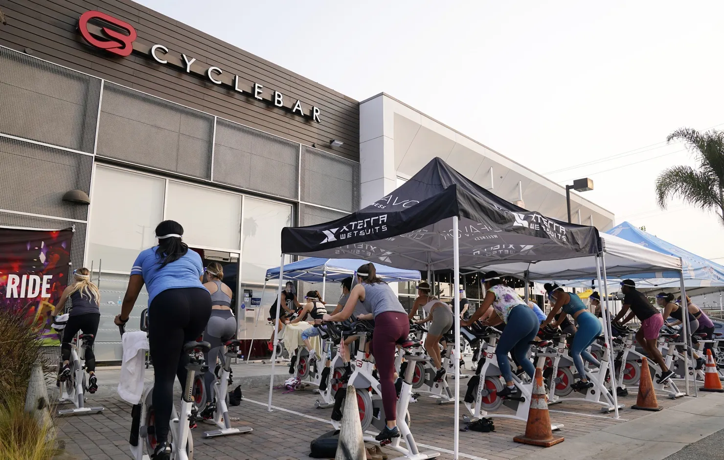 A fitness class held outside a CycleBar in Culver City, California.