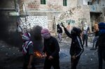 Palestinian youth clash&nbsp;with Israeli police Thursday in Jerusalem.