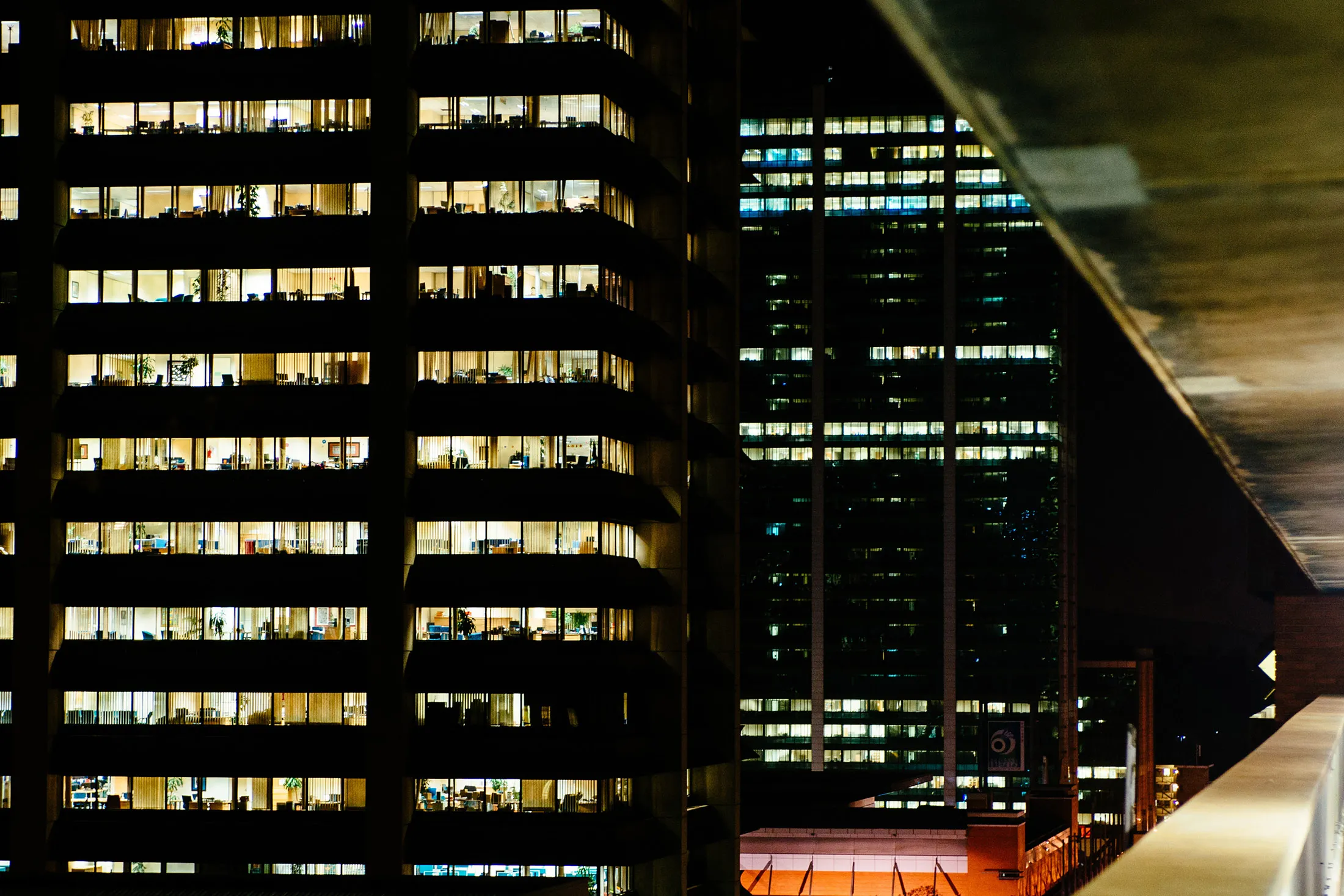 Electrical lights illuminate offices inside a commercial building at night in Pretoria, South Africa, on Wednesday, Oct. 5, 2016. Eskom Holdings SOC Ltd. is building new electricity stations to end the power cuts that were imposed for about 100 days last year, curbing growth in Africa's most-industrialized nation.
