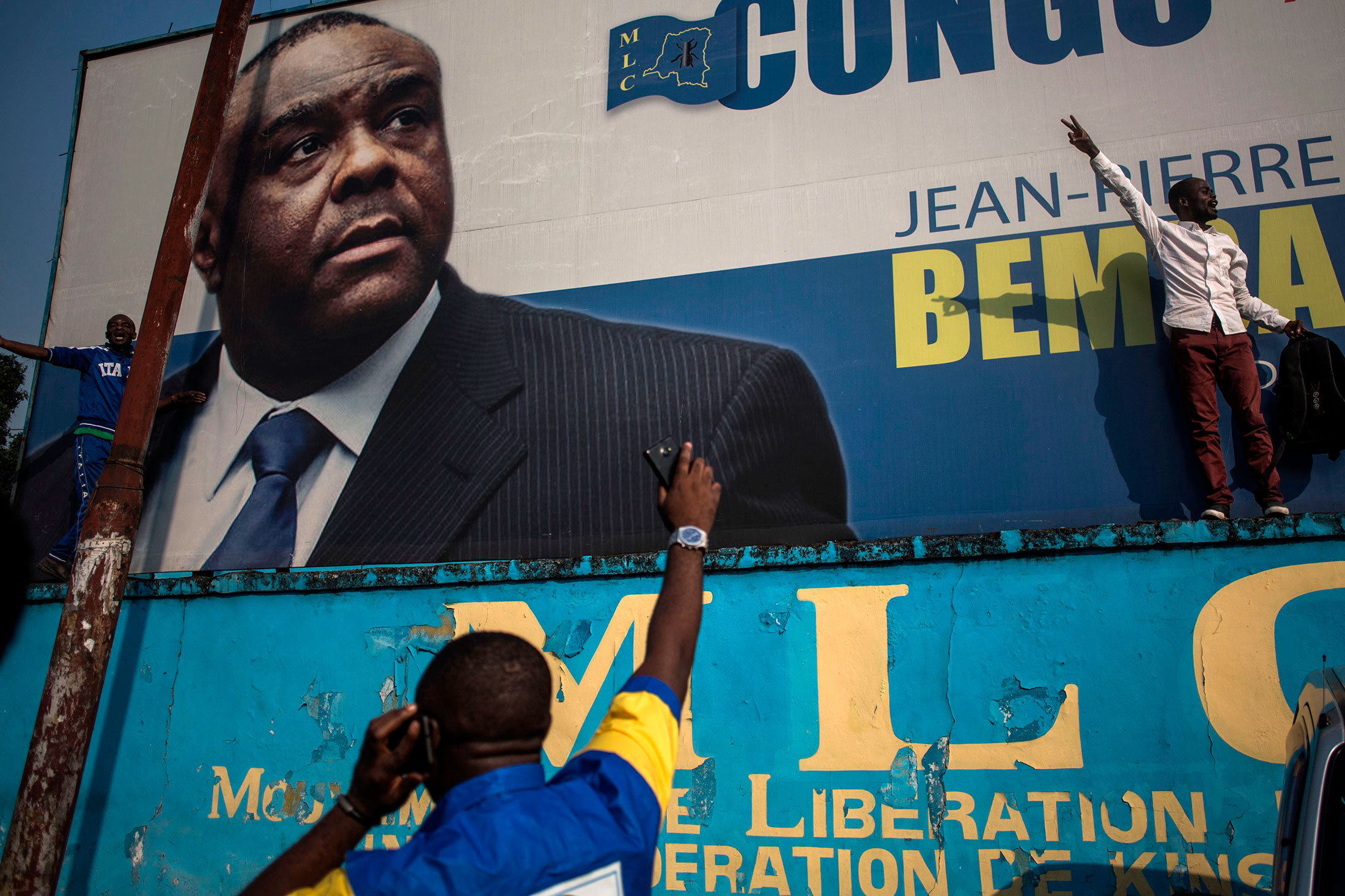 Supporters of Jean-Pierre Bemba in front of his picture in Kinshasa.