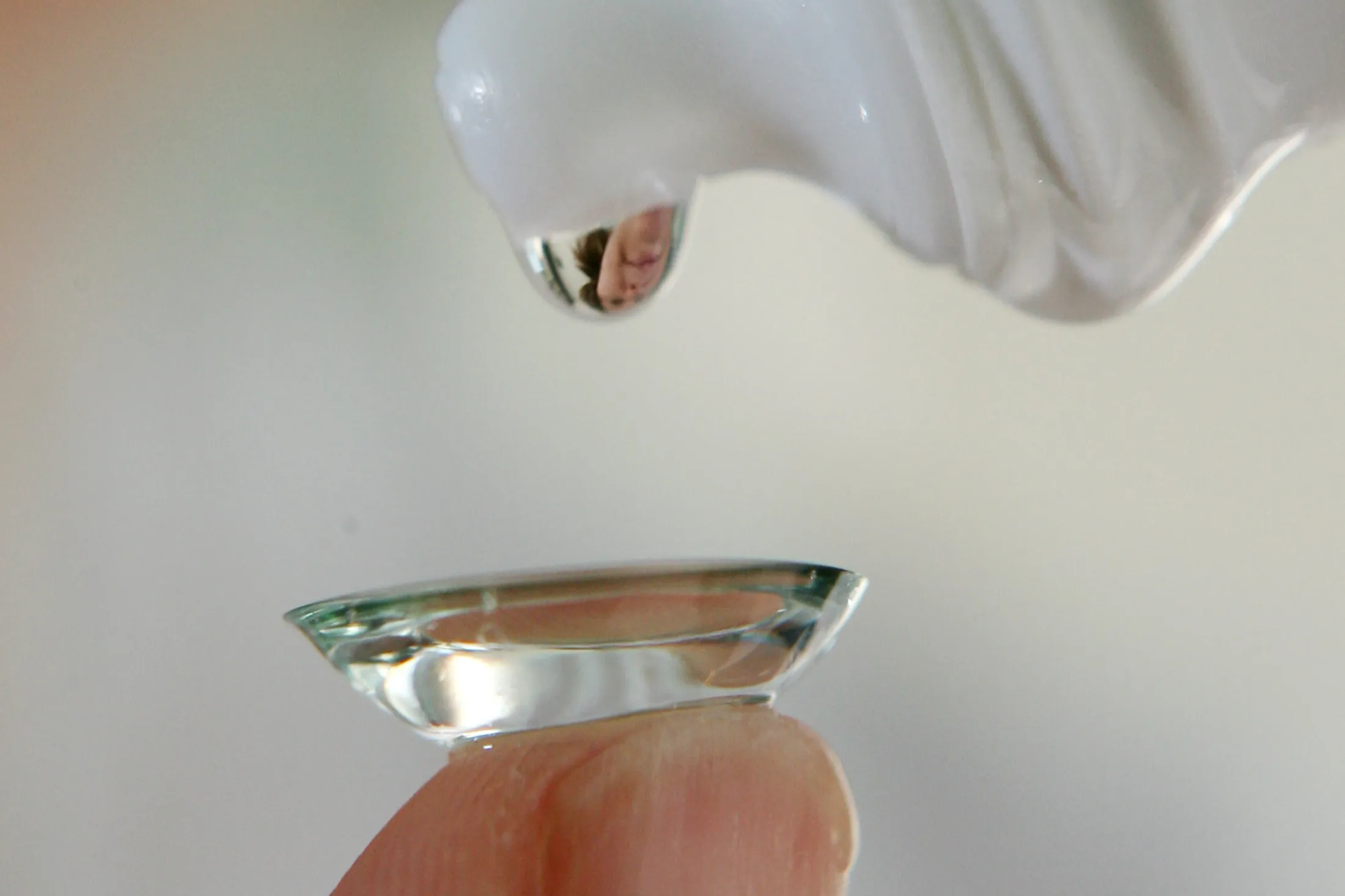 Bloomberg staffer Sara Marley puts in her contact lens at he
