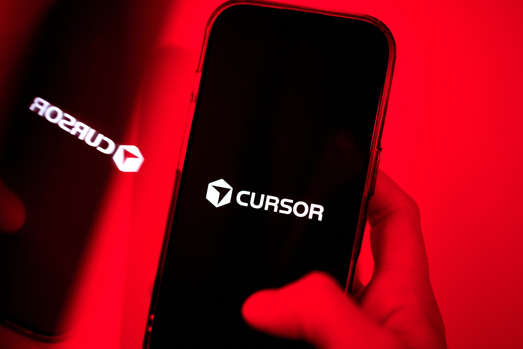 The Cursor logo on a smartphone Photographer: Gabby Jones/Bloomberg