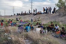 Migrants on the banks of the Rio Grande at the US-Mexico border in Ciudad Juarez, Mexico in April.