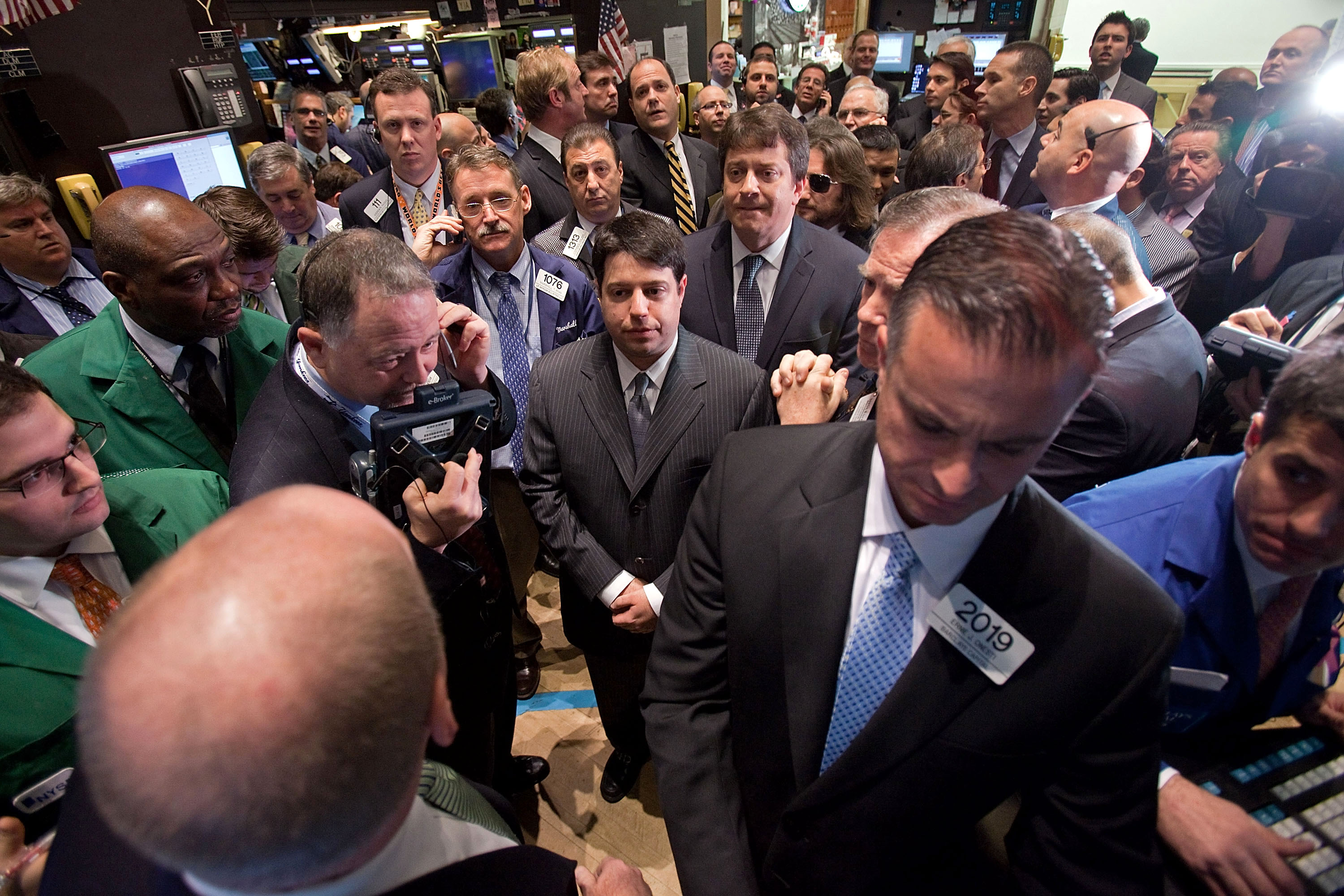 Drew Niv, founding partner and chief executive officer of FXCM Inc., center, attends the opening bell ceremony at the New York Stock Exchange on Dec. 2, 2010. 
