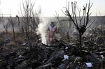 Rescue workers search the scene where an Ukrainian plane crashed in Shahedshahr, southwest of the capital Tehran on Jan. 8, 2020.