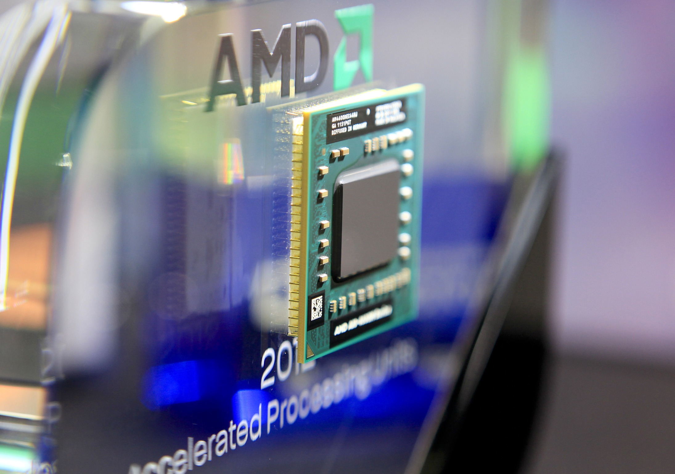An Advanced Micro Devices Inc. AMD-A10-4600M Series APU computer chip is displayed at the AMD booth at Computex Taipei 2012 in Taipei, Taiwan.