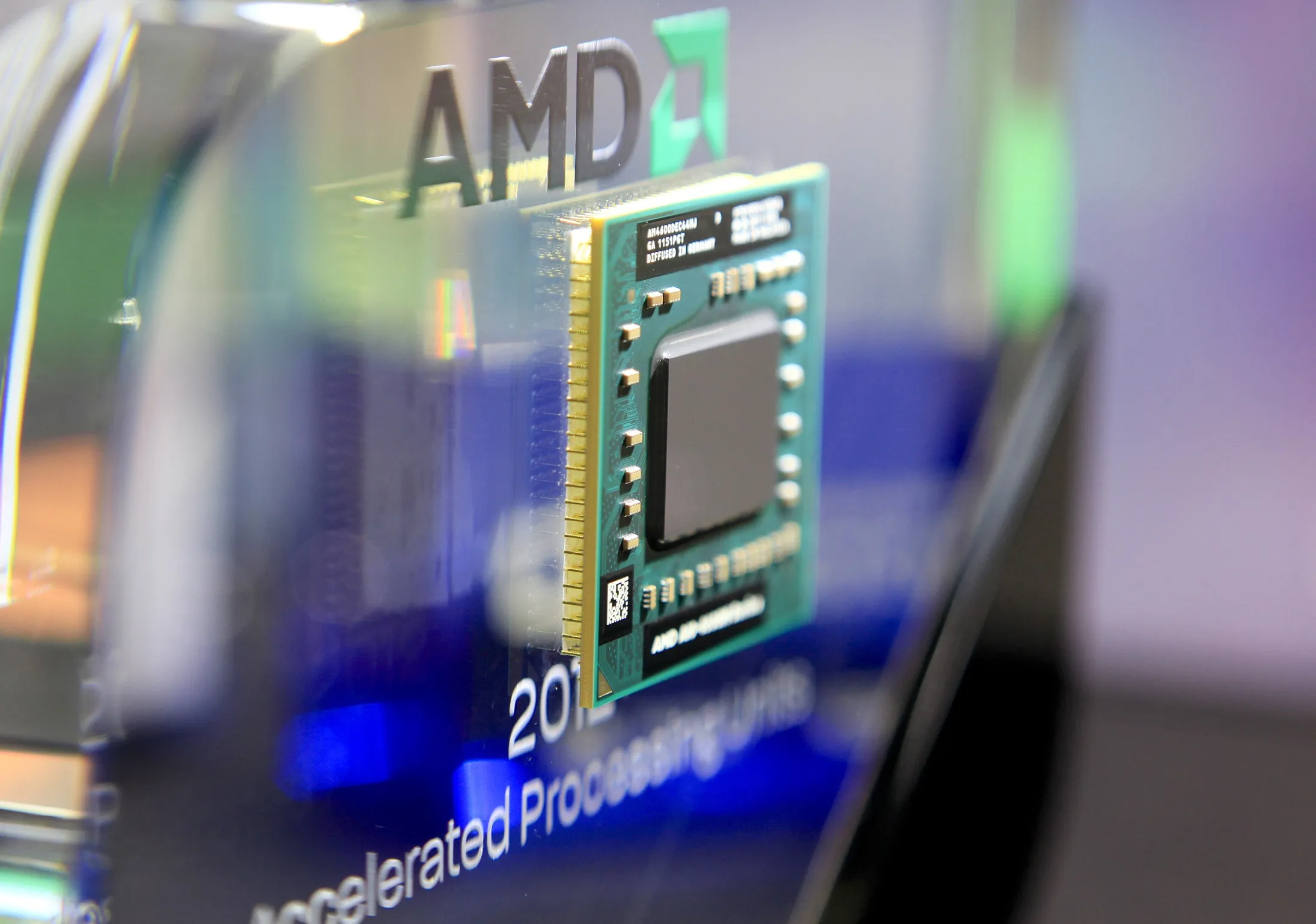 An Advanced Micro Devices Inc. AMD-A10-4600M Series APU computer chip is displayed at the AMD booth at Computex Taipei 2012 in Taipei, Taiwan.