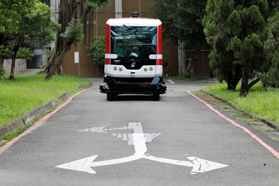 A French-made autonomous bus cruises through a university campus in Taipei.