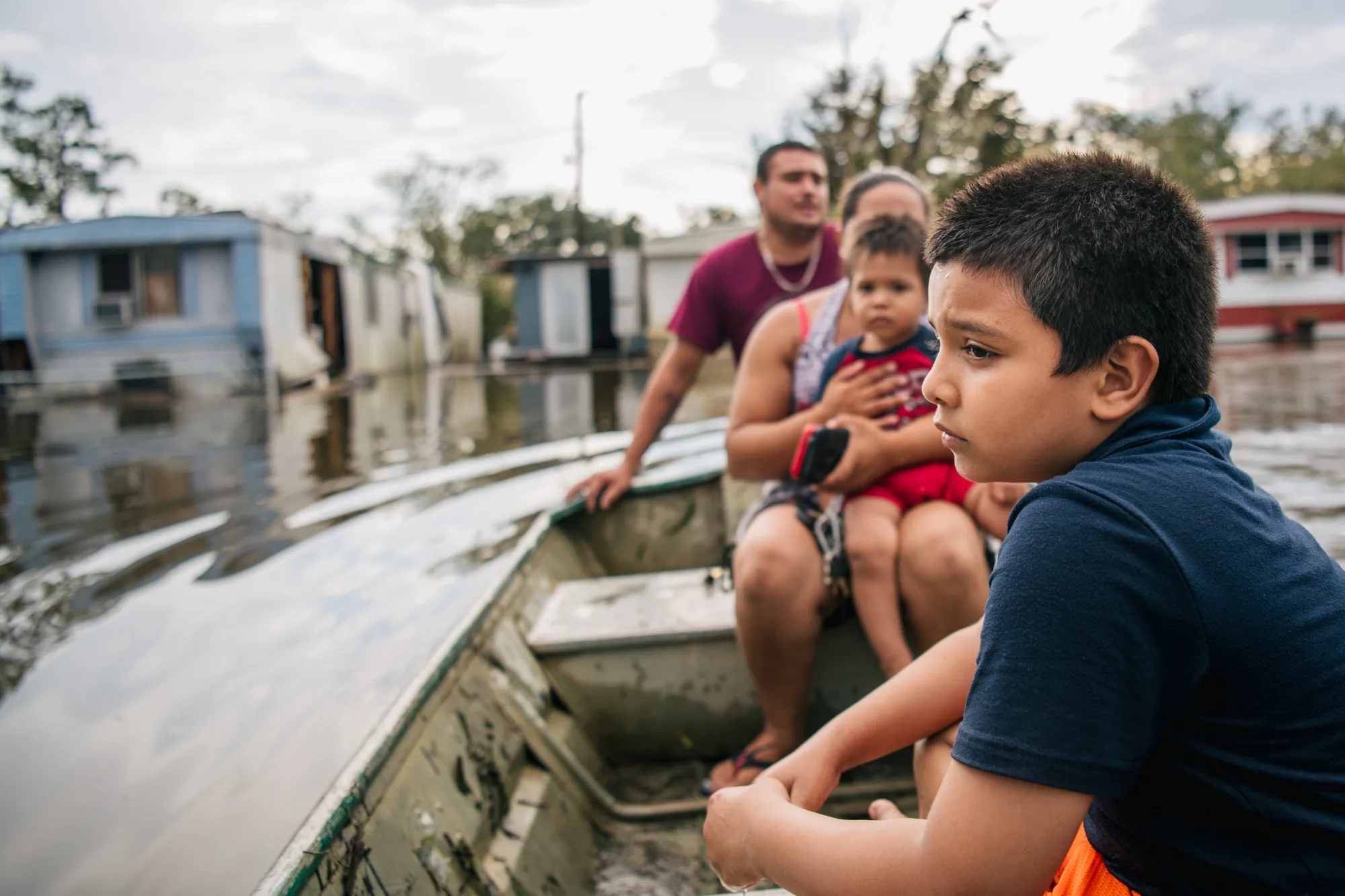 A family in Barataria, Louisiana, returns to&nbsp;their home after it flooded during Hurricane Ida in August 2021.&nbsp;