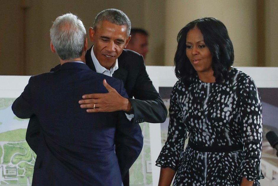 Barack Obama and Michelle Obama are greeted by Rahm Emanuel during a community event on the Obama Presidential Center at the South Shore Cultural Center in Chicago, May 3, 2017.