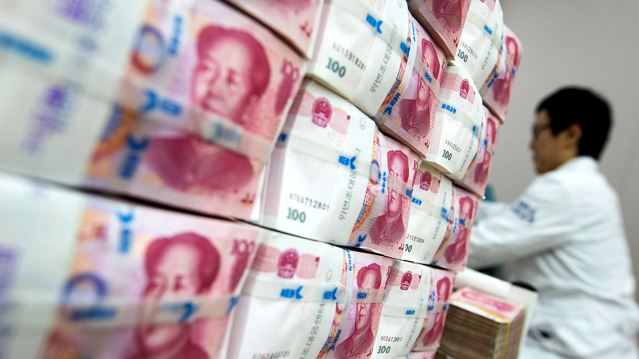 Chinese one-hundred yuan banknotes at the Korea Exchange Bank headquarters in Seoul.
