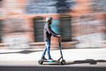 A technician test drives a Skip Transportation Inc. scooter outside company's repair shop in San Francisco, California, U.S.