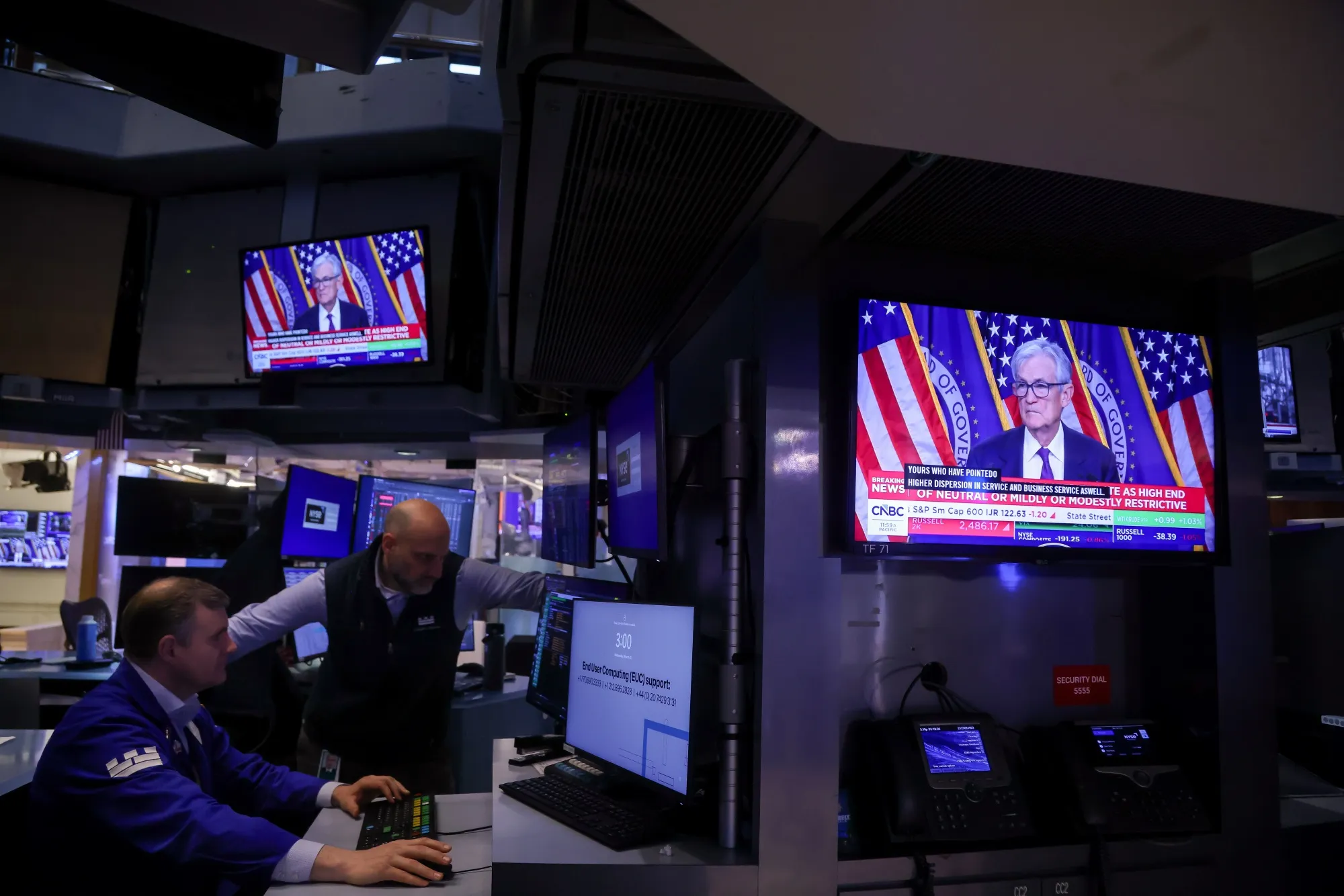 A television station broadcasts Jerome Powell, chairman of the US Federal Reserve, speaking after a Federal Open Market Committee (FOMC) meeting on the floor of the New York Stock Exchange (NYSE) in New York on March 18.