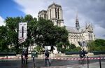 French police officials gather at a cordonned-off area at Notre-Dame Cathederal in Paris on June 6, 2017. A French police officer has shot and injured a man who attacked him with a hammer outside Paris's Notre-Dame cathedral authorities said. Police sealed off the area in front of the cathedral, where the attacker lay injured on the ground. / AFP PHOTO / Martin BUREAU (Photo credit should read MARTIN BUREAU/AFP/Getty Images)
