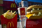 A McDonald's Corp. Big Mac meal is arranged for a photograph outside of a restaurant in San Francisco, California, U.S., on Wednesday, Jan. 22, 2014. McDonald's Corp., the world's largest restaurant chain, posted fourth-quarter profit that was little changed from a year earlier as U.S. same-store sales fell amid shaky consumer confidence and increased competition.