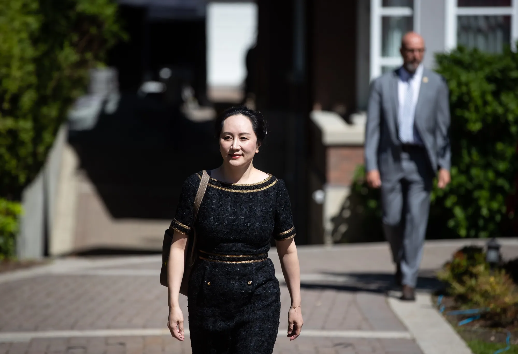 Meng Wanzhou leaves her home in May to attend Supreme Court for an extradition hearing in Vancouver.