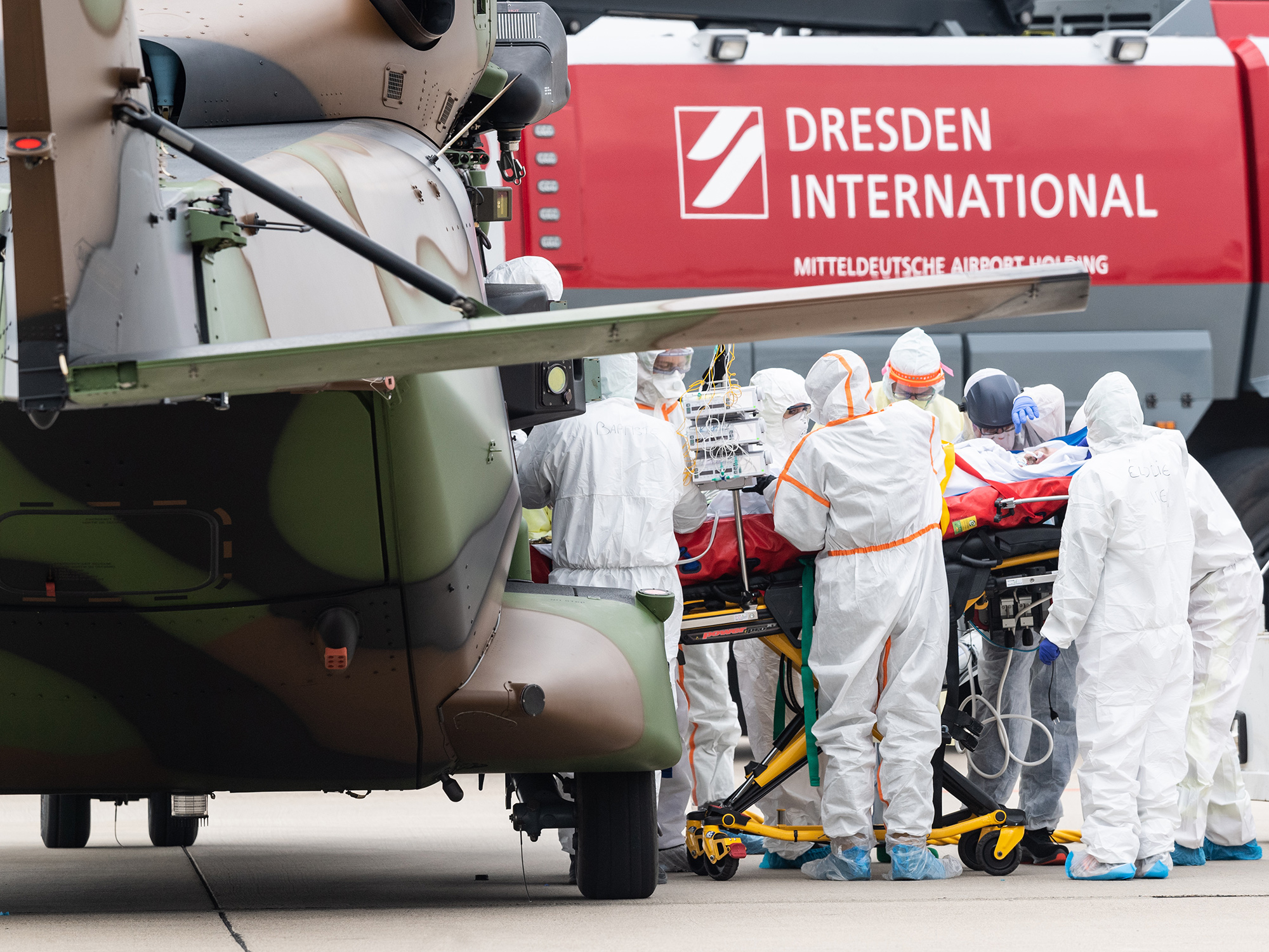 A Covid-19 patient is unloaded from a military transport helicopter at Dresden International Airport, in Germany, on April 4.