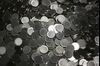 Blank coins sit before being minted into currency by the U.S. Federal Government at the Denver Mint in Denver, Colorado, U.S., on Wednesday, Oct. 28, 2015. After last week's two-year bipartisan budget plan that Congress passed to avoid a default on U.S. debt, House and Senate appropriators are already hard at work on the encore act: A $1.1 trillion omnibus spending package needed to keep the government open after Dec. 11.