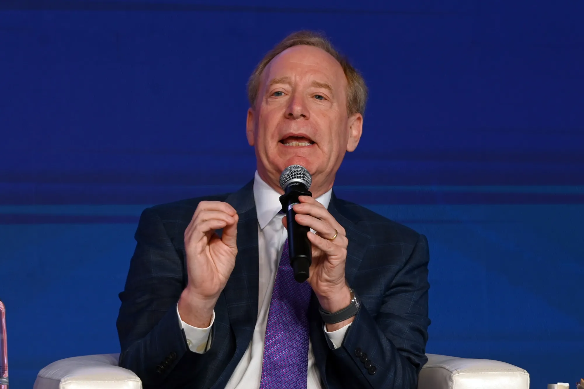 Brad Smith, president of Microsoft Corp., speaks during the Business 20 Summit in New Delhi in August 2023.&nbsp;