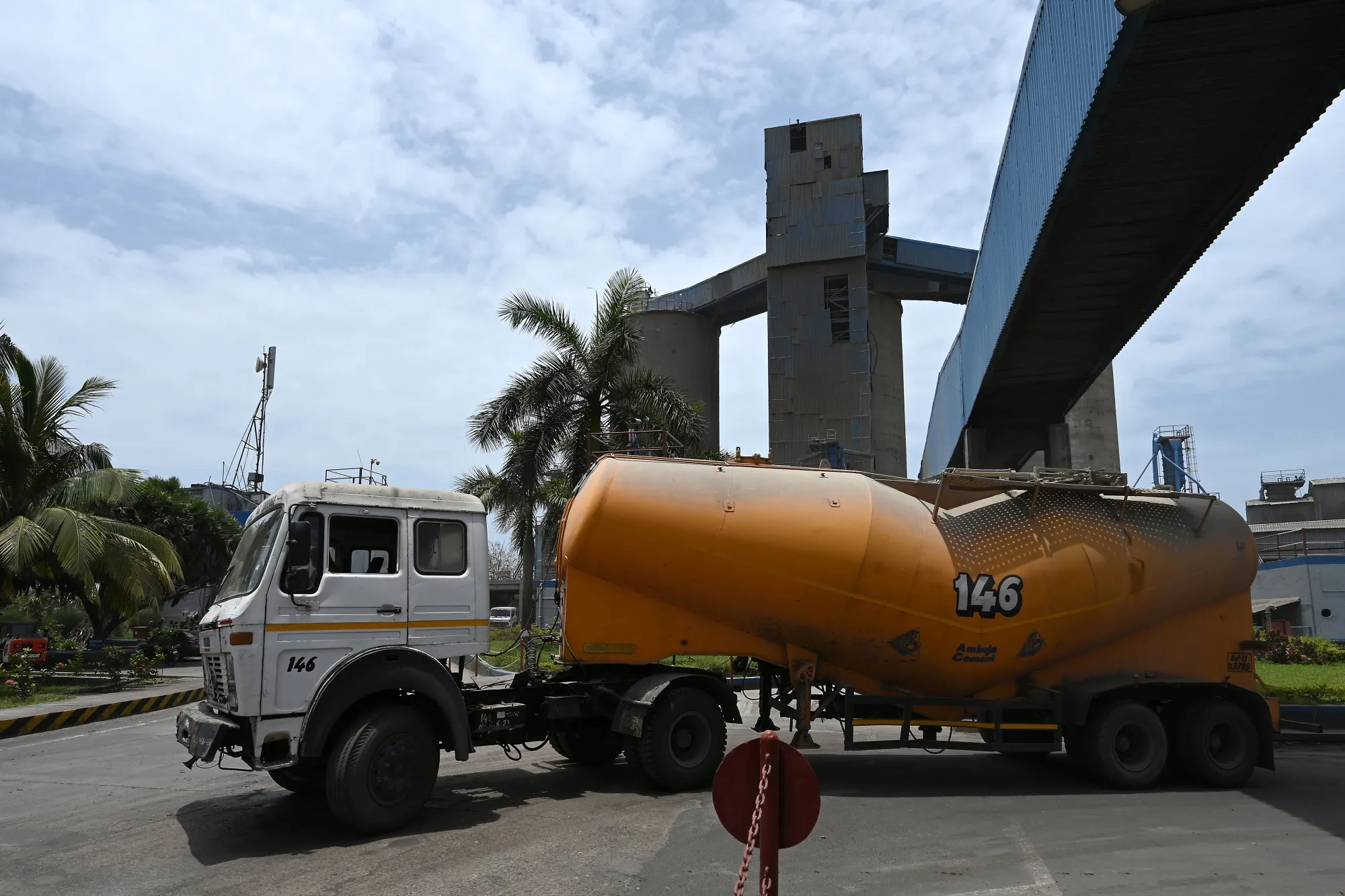 A cement truck leaves the Mul Dwarka port near the Ambuja Cements Ltd. factory in Ambuja Nagar, Gujarat, India.