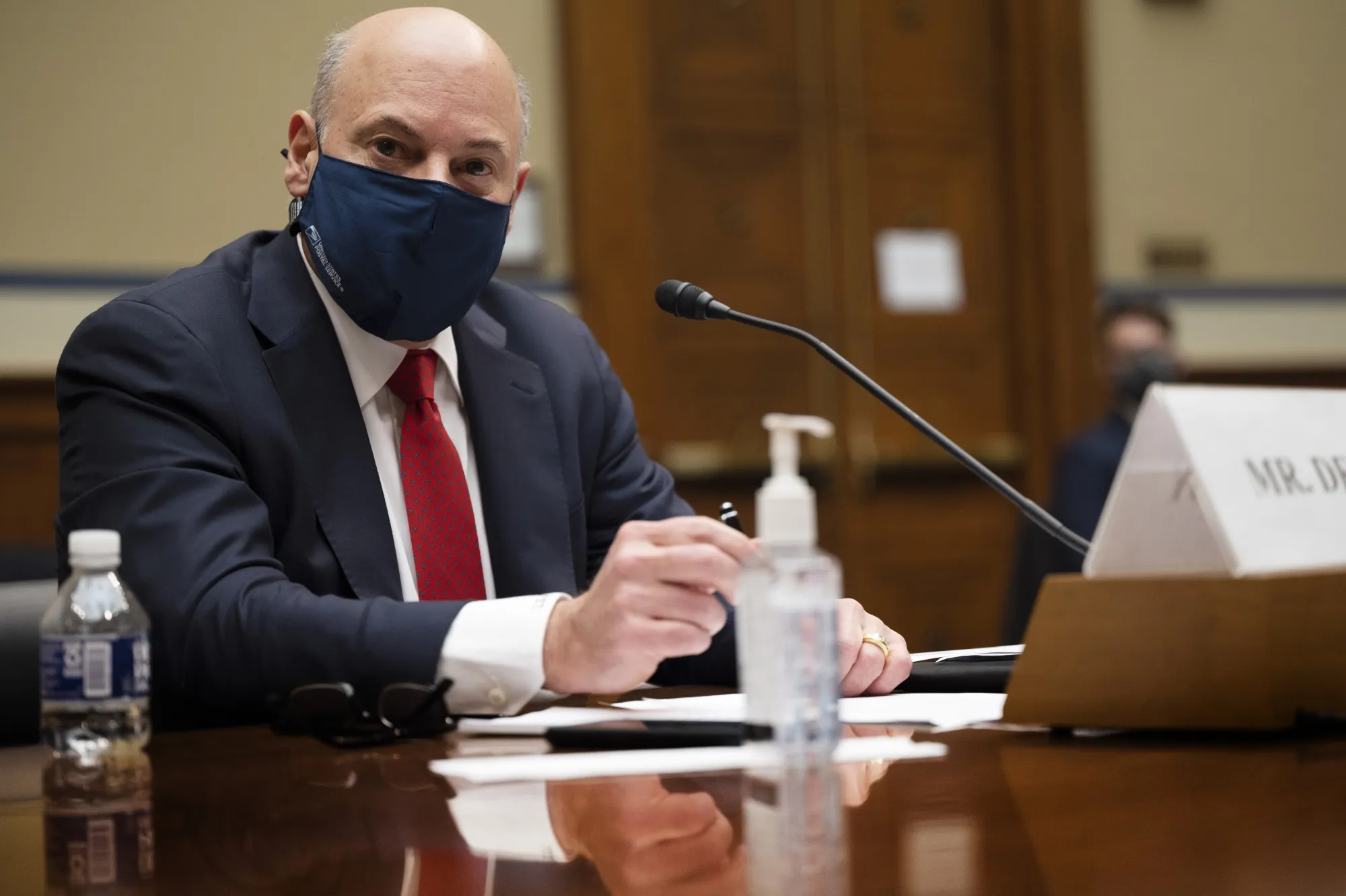 Louis DeJoy arrives to a House Oversight and Reform Committee hearing in Washington, D.C., on Feb. 24.&nbsp;