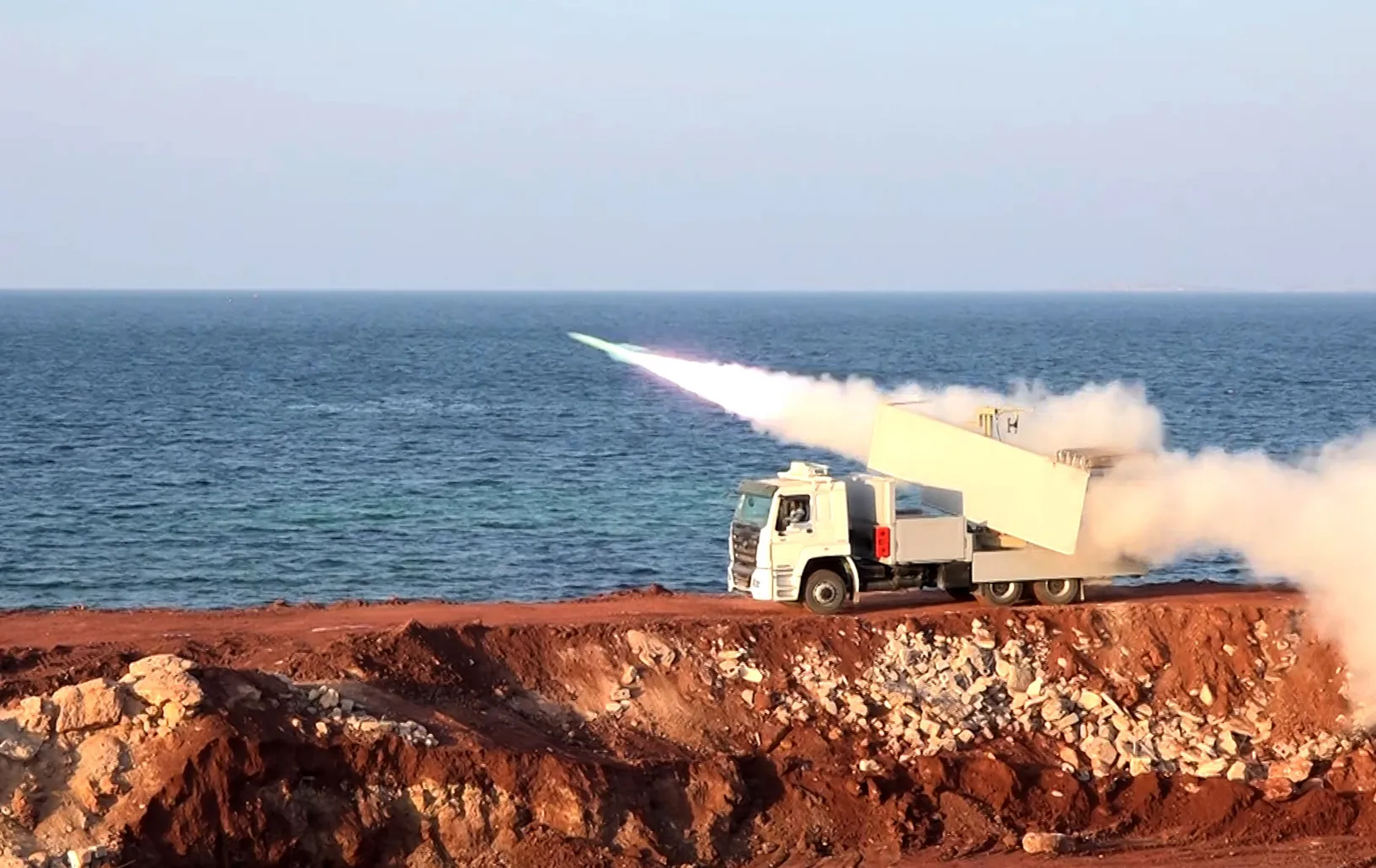 Iranian military personnel practicing on he Strait of Hormuz