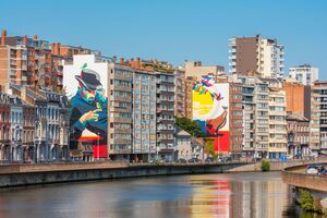 Giant diptych Murals on walls along the Meuse River in Liege, Wallonia, Belgium