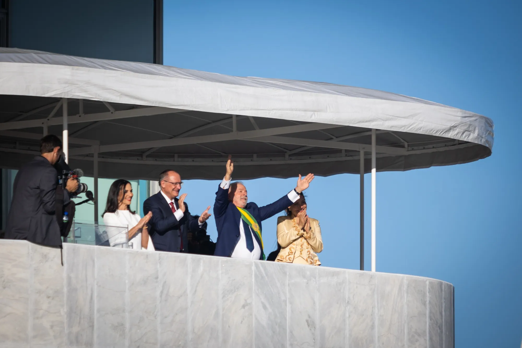 Luiz Inacio Lula da Silva, center, waves to the crowd at Planalto Palace in Brasilia after being sworn in as president in January 2023.