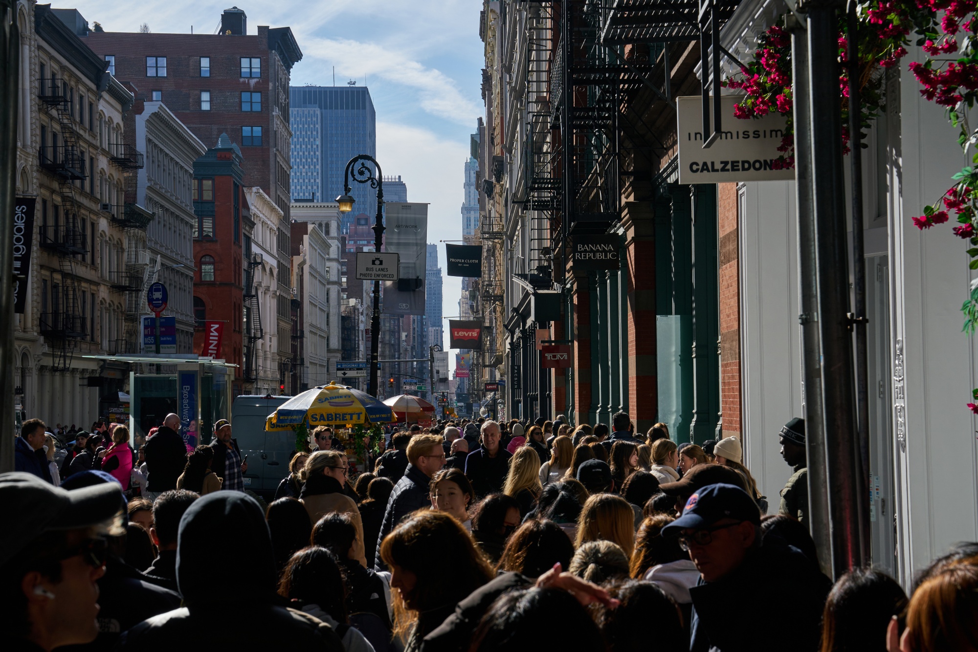 Black Friday sale shoppers stand in line at the Fashion Show Mall