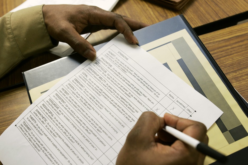 Carnell Carter fills out a self-survey of his work skills while working at a branch office of the state's WorkSource agency the Pierce County Community Justice Center in Tacoma, Wash. 