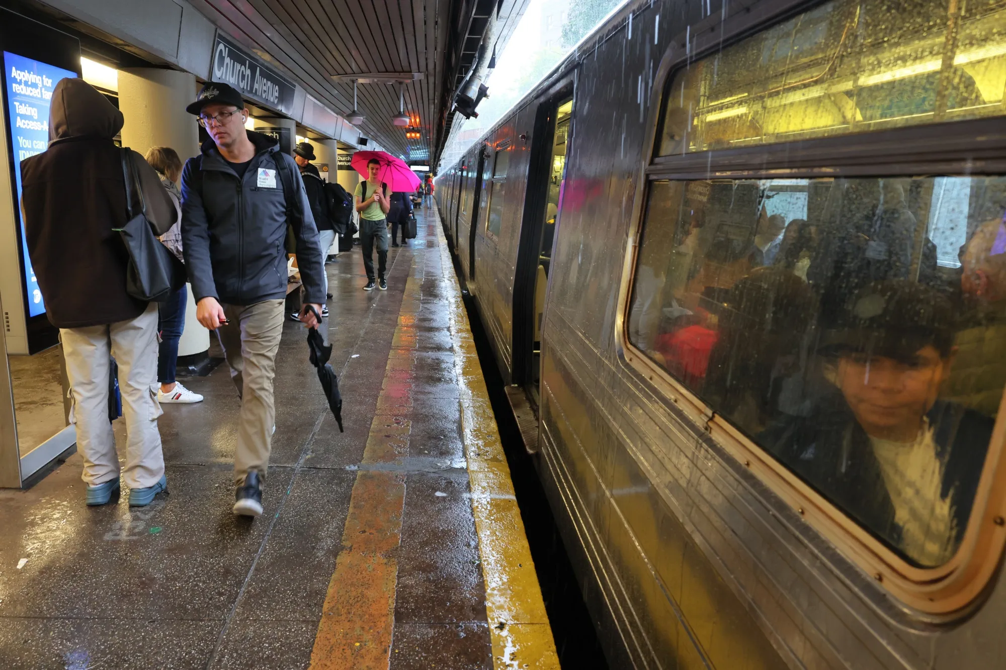 Commuters&nbsp;at the Church Avenue subway station as subway service is stopped amid heavy rain in New York City.&nbsp;