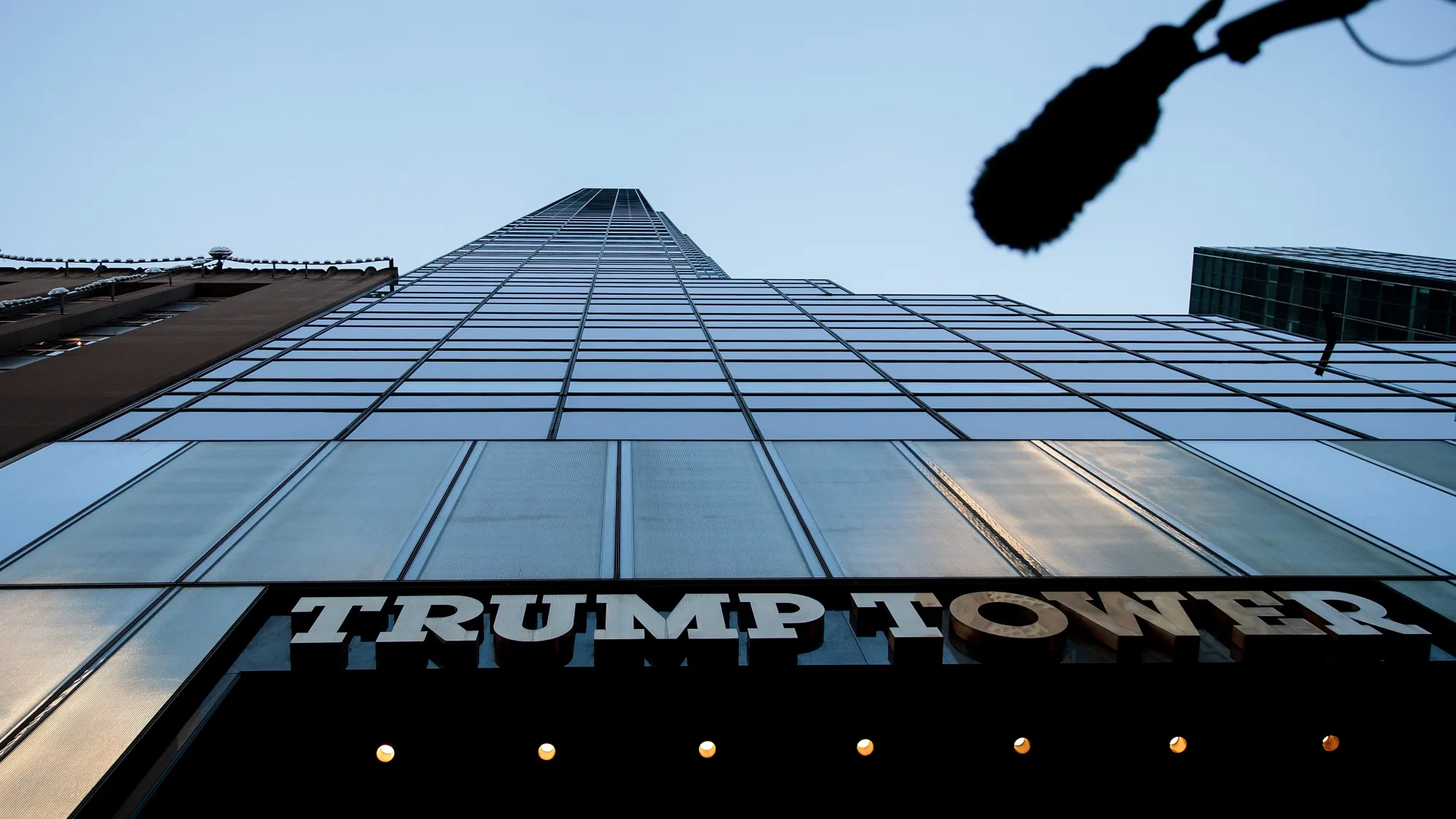 A boom microphone hangs overhead during a protest against Republican presidential candidate Donald Trump for his treatment of women, in front of Trump Tower on Oct. 17, 2016, in New York City.
