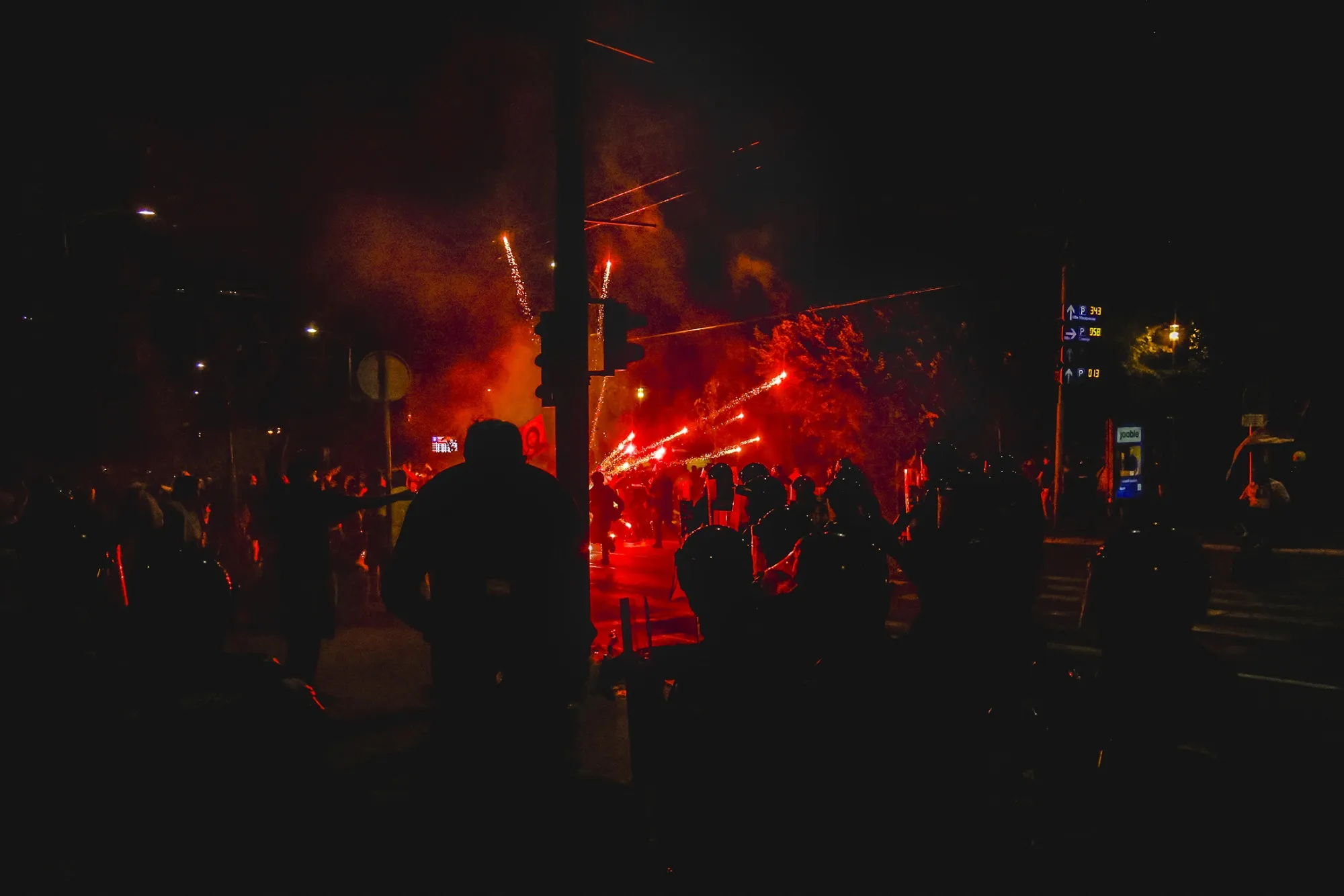 Serbian riot police clash with anti-government protesters in Belgrade on Aug.&nbsp;14.&nbsp;