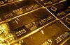 A mark of 999.9 fine sits on hallmarked 12.5 kilogram gold bullion bars stacked at the Valcambi SA precious metal refinery in Balerna, Switzerland, on Tuesday, April 24, 2018. Gold's haven qualities have come back in focus this year as President Donald Trump’s administration picks a series of trade fights with friends and foes, and investors fret about equity market wobbles that started on Wall Street and echoed around the world.
