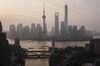 The Oriental Pearl Tower, center left, Shanghai World Financial Center, center, and the Shanghai Tower, center right, stand among other buildings in the Lujiazui Financial District along the Pudong riverside in this aerial photograph taken above Shanghai, China, on Monday, April 2, 2018. China's sprawling local government financing system needs "crucial" reforms to increase consumption, build prosperity and encourage economic rebalancing, the International Monetary Fund said.