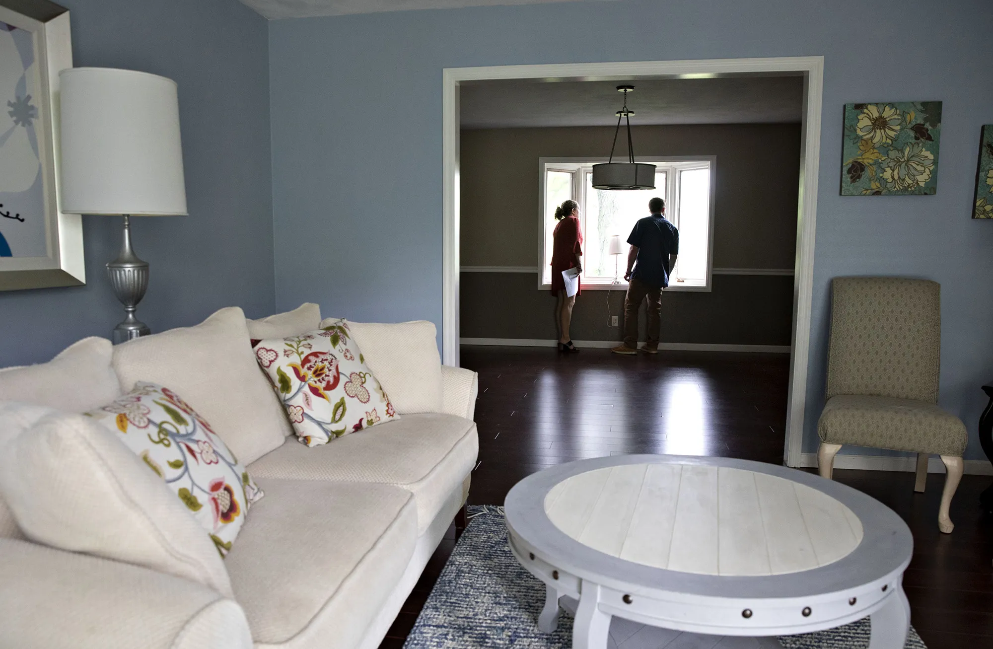 A real estate agent shows a prospective home buyer a house for sale in Peoria, Illinois.