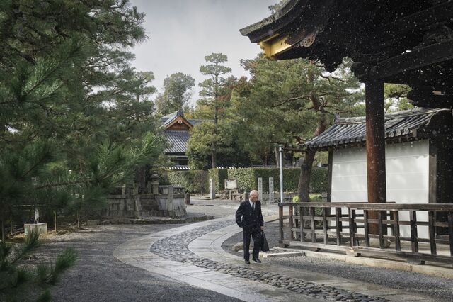 A man walks along the road at the Daitoku-ji campus, which has 20 diverse subtemples. 