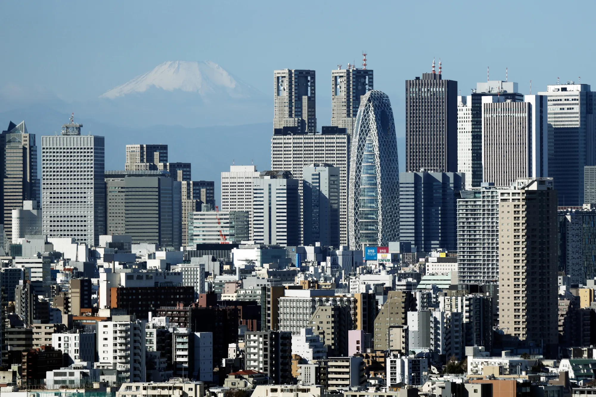 Mount Fuji and the Shinjuku skyline in Tokyo, Japan, on Friday, Feb. 14, 2025. Japan is scheduled to release its fourth-quarter gross domestic product (GDP) figures on Feb. 17.