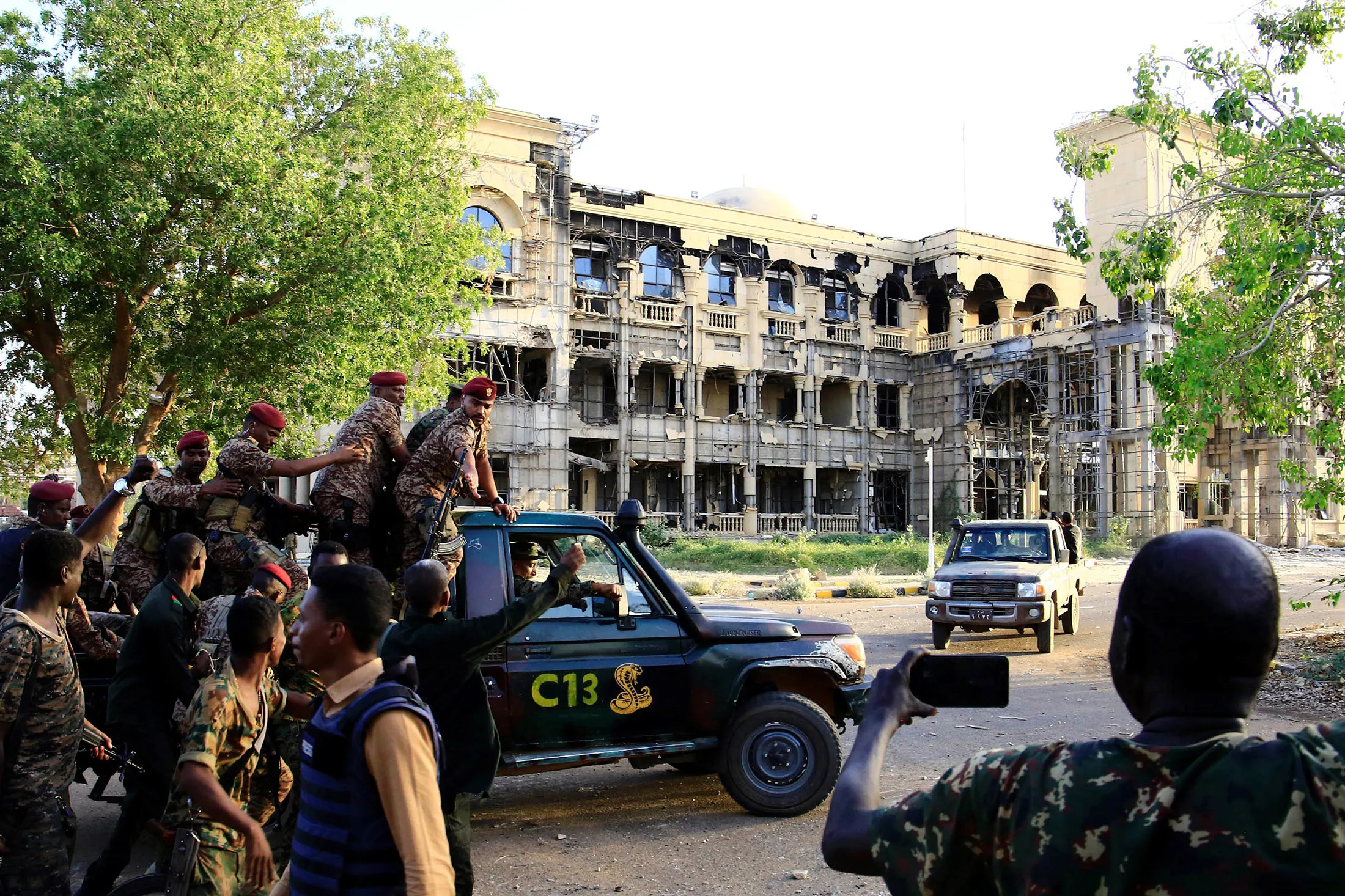 Members of the Sudanese Armed Forces depart from the Presidential Palace in Khartoum, Sudan, on March 26.