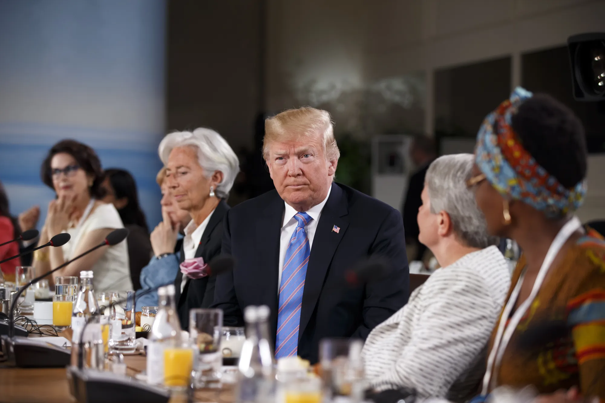 Trump, center, sits after arriving late for the G-7 gender equality meeting on May 10.