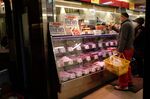 A shopper purchases meat at a store in Kamakura, Kanagawa Prefecture.